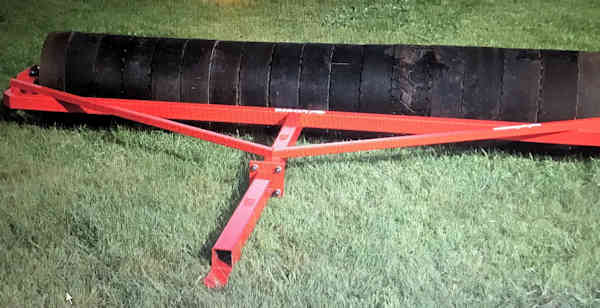 40 foot roller in front of Bison Engineering